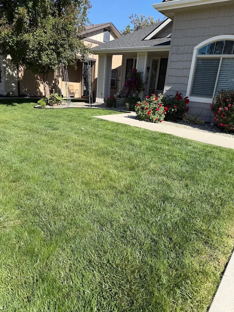 Well-maintained lawn and landscaping in front of an Idaho home