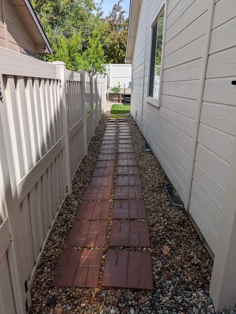 The same side pathway after weeds were removed and the area was cleaned